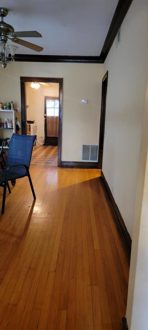 10652 South Ave B Chicago, IL 60617 - Photo 7 of 18 a view of a room with gym equipment