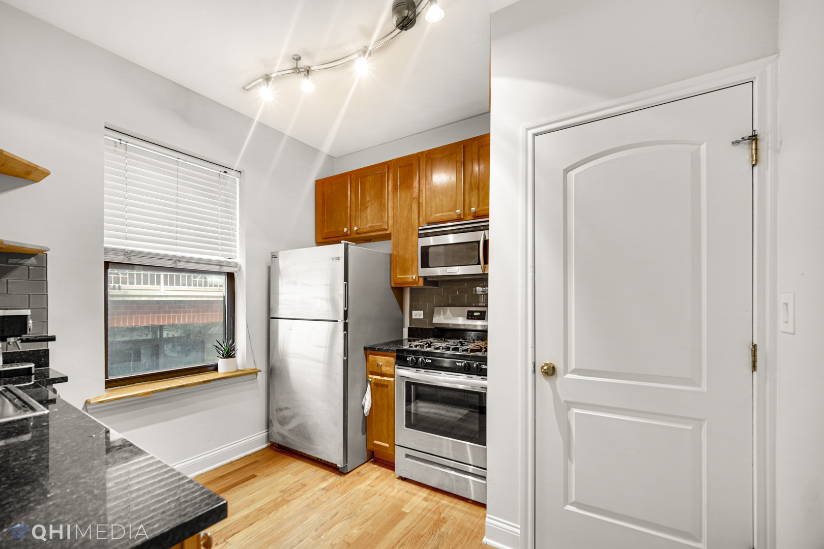 4014 North Spaulding Avenue, Unit 3 Chicago, IL 60618 - Photo 14 of 16 a kitchen with a refrigerator and a stove