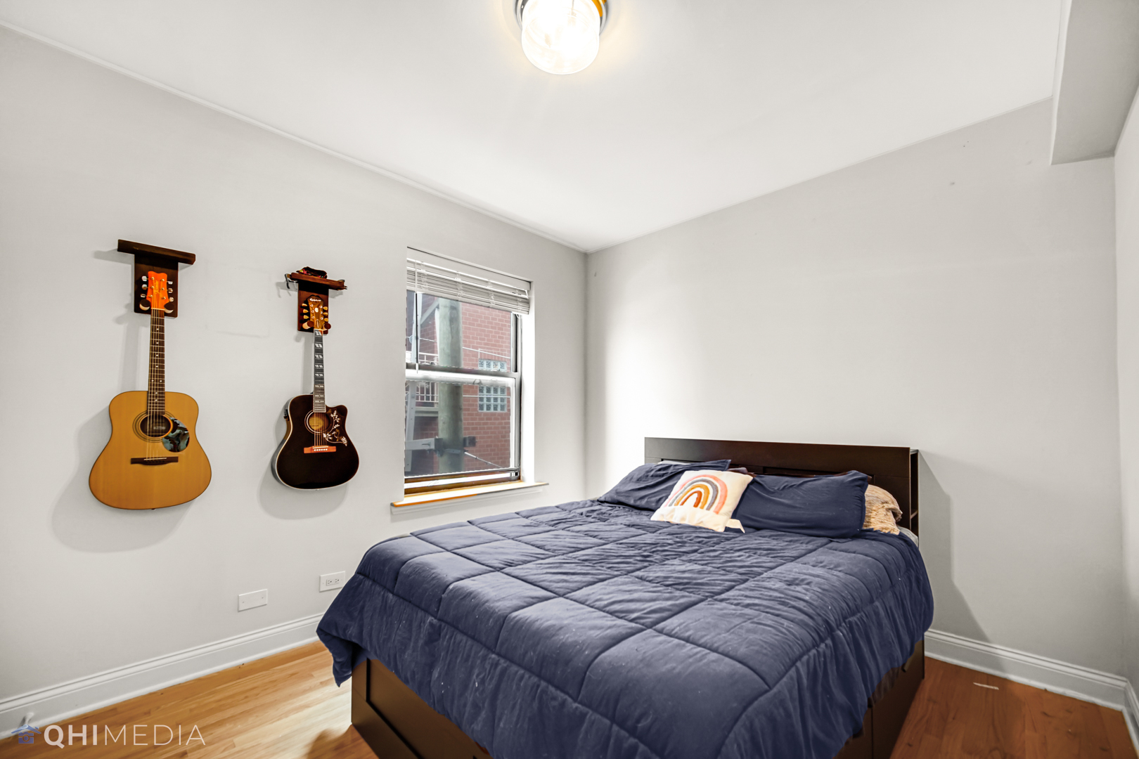 4014 North Spaulding Avenue, Unit 3 Chicago, IL 60618 - Photo 15 of 16 a bedroom with a bed and a window