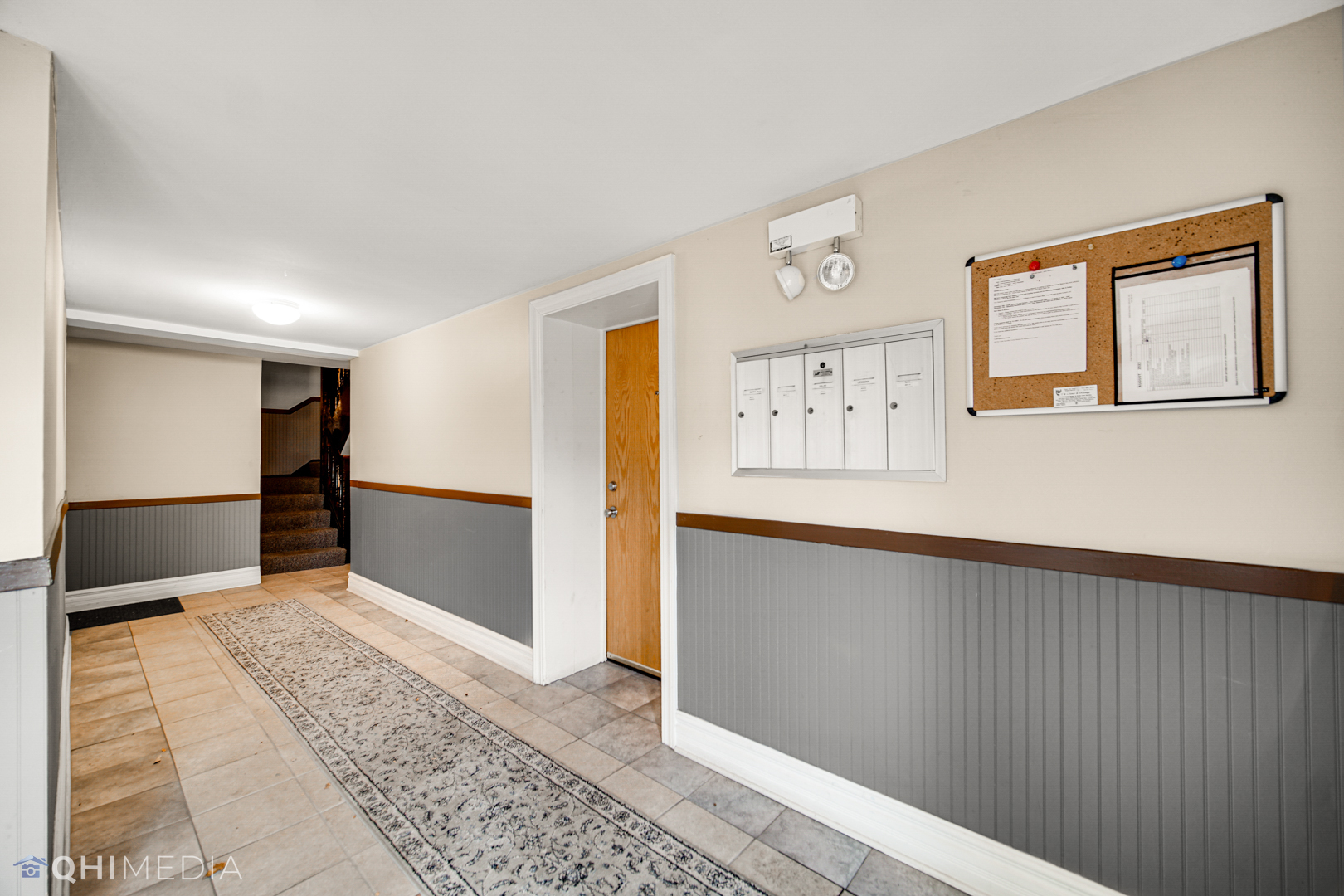 4014 North Spaulding Avenue, Unit 3 Chicago, IL 60618 - Photo 4 of 16 a view of a big room with wooden floor and windows
