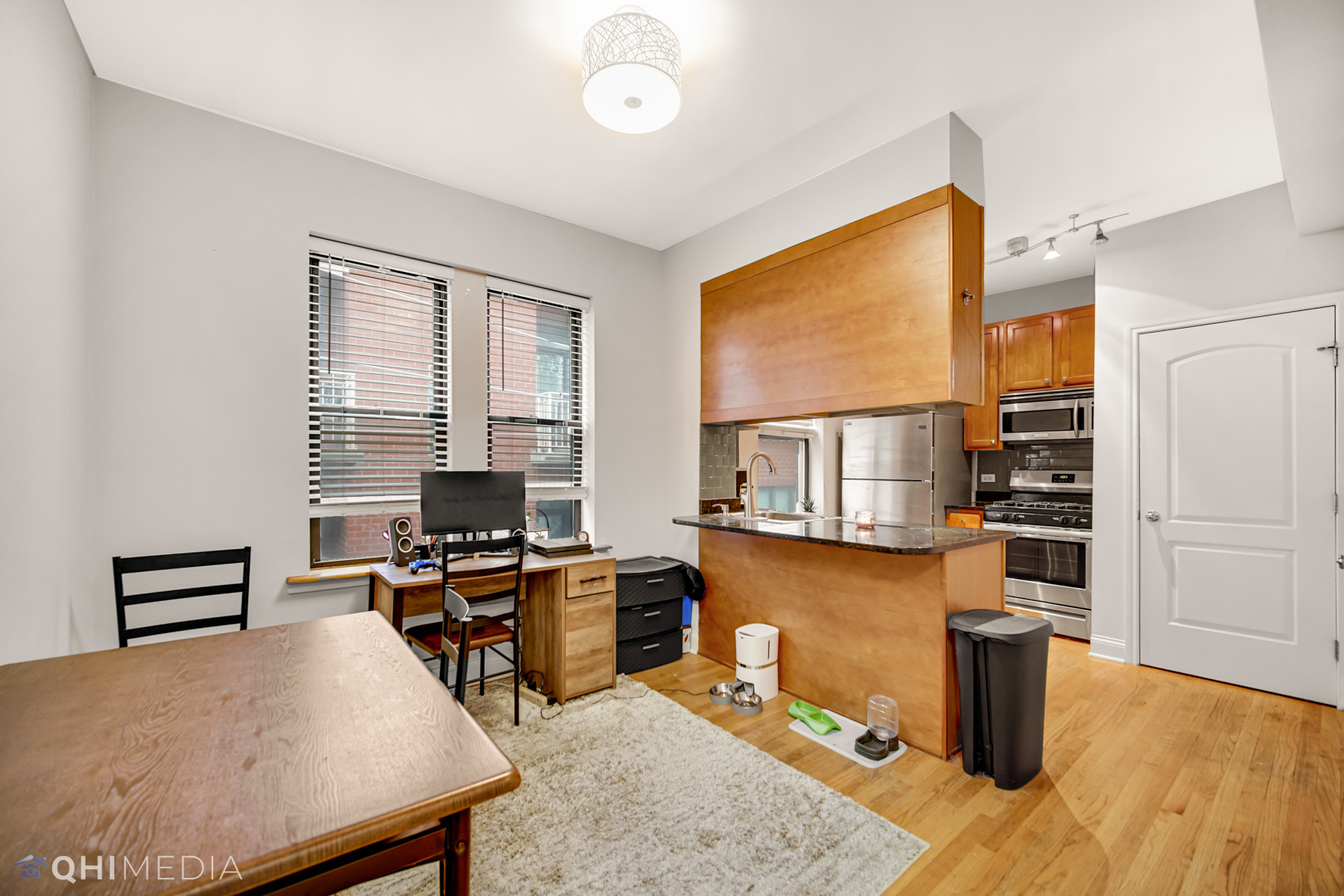 4014 North Spaulding Avenue, Unit 3 Chicago, IL 60618 - Photo 10 of 16 a room with furniture pool table and windows