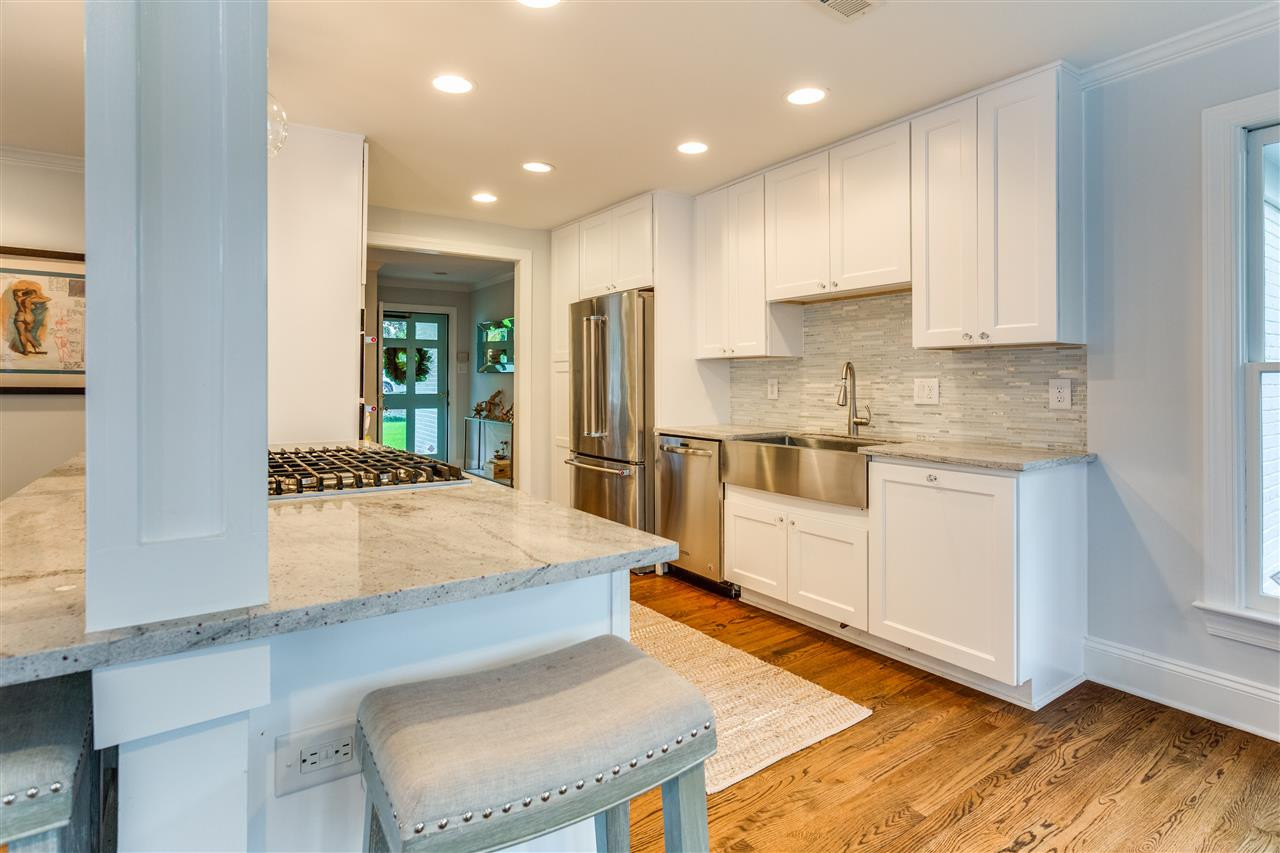 2715 Rothgeb Drive Raleigh, NC 27609 - Photo 9 of 25 NEWLY UPDATED KITCHEN THAT MAKES THE MOST OF THIS GREAT SPACE. BAR SEATNG, NEW RECESSED AND PENDANT LIGHTING BRIGHTEN UP THIS BEAUTIFUL KITCHEN. Kitchen