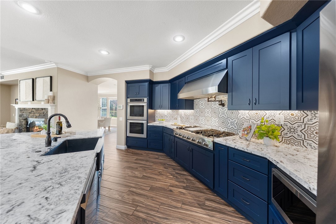 31465 Inverness Court Temecula, CA 92591 - Photo 21 of 75 Rich cabinetry granite countertops and inexpensive center island create a sophisticated and functional culinary space | Professionally Staged