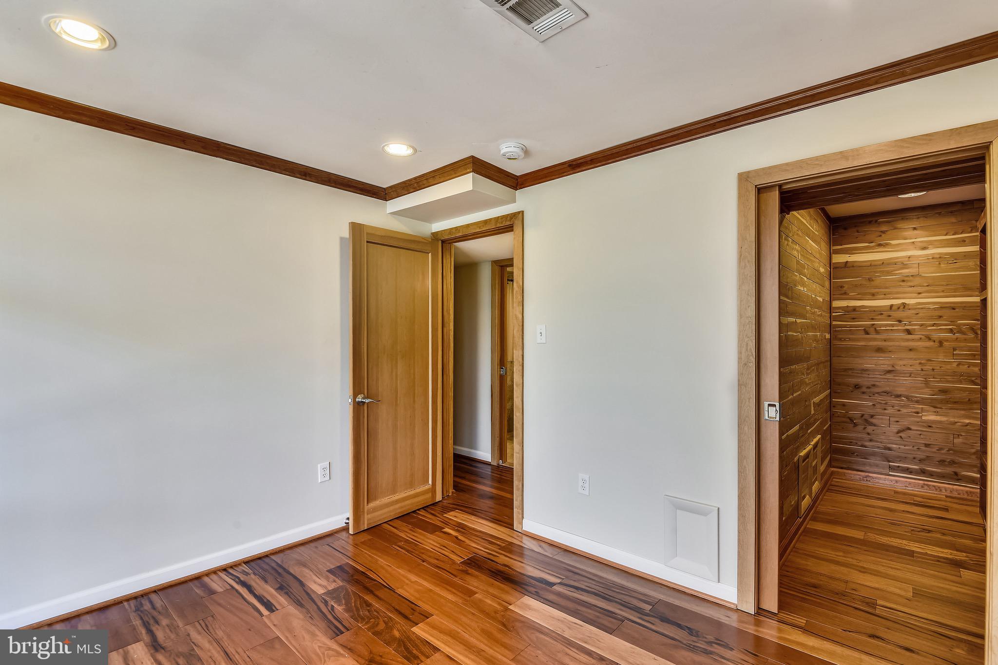 3003 Cedar Hill Road Falls Church, VA 22042 - Photo 23 of 40 Cedar closet, crown molding, and tigerwood floors.