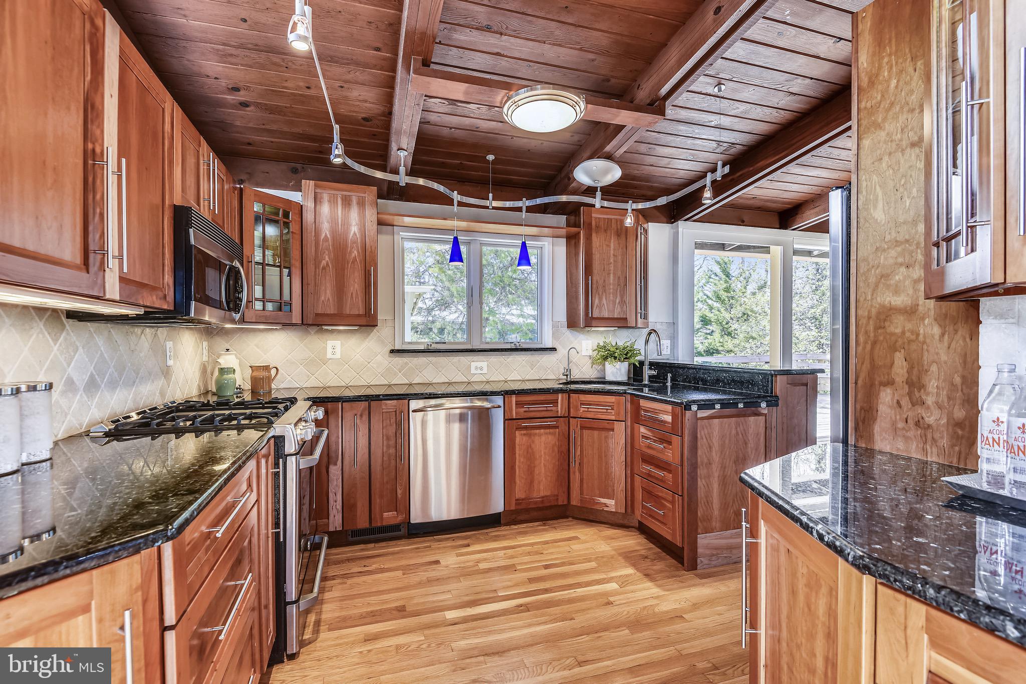 Stainless appliances and granite countertops.
