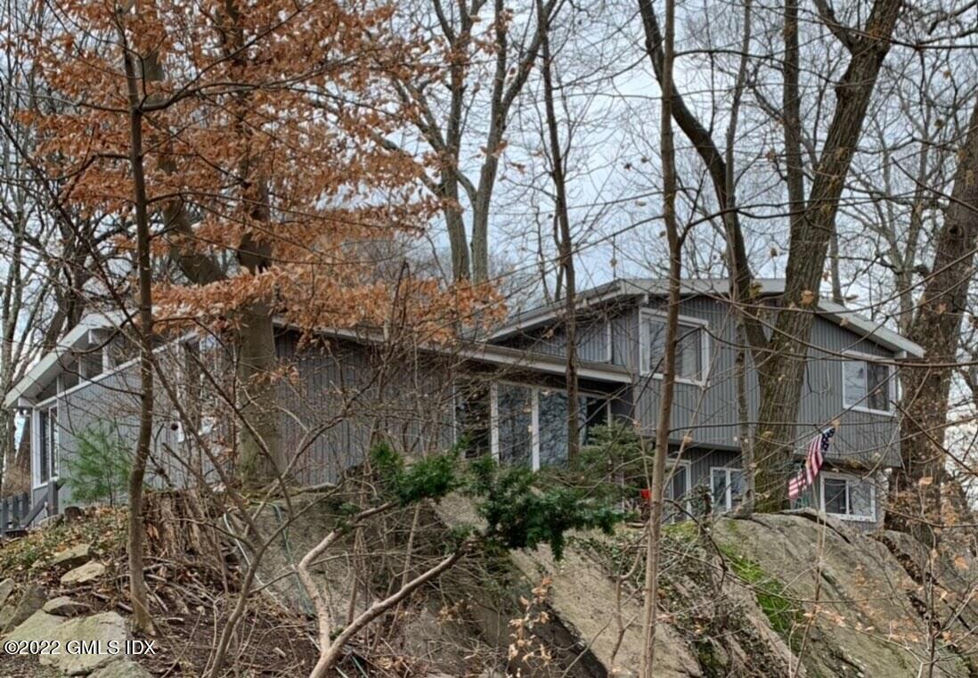 94 Florence Road Riverside, CT 06878 - Photo 1 of 25 a front view of a house with garden