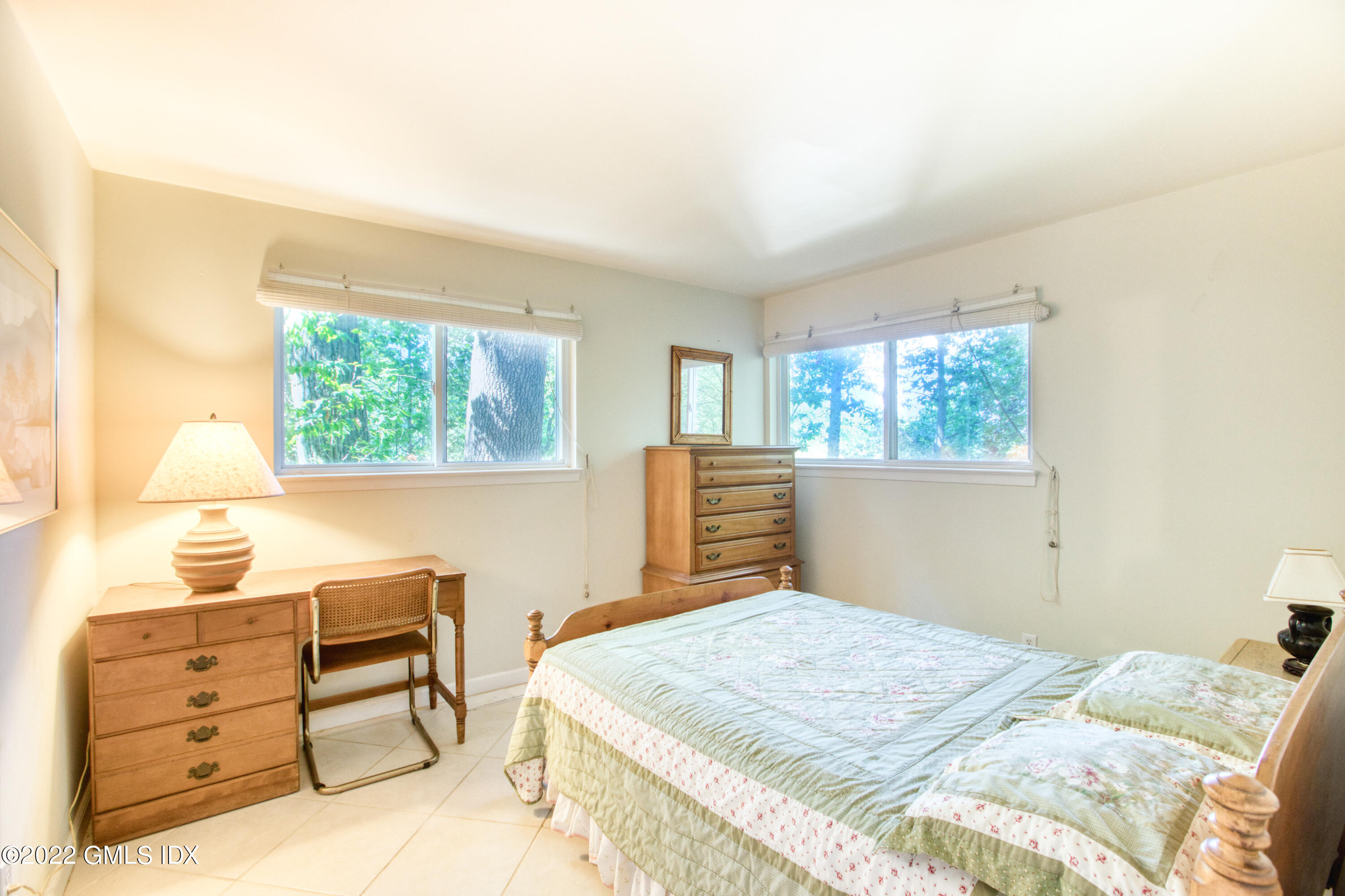 94 Florence Road Riverside, CT 06878 - Photo 15 of 25 a bedroom with a bed and a window