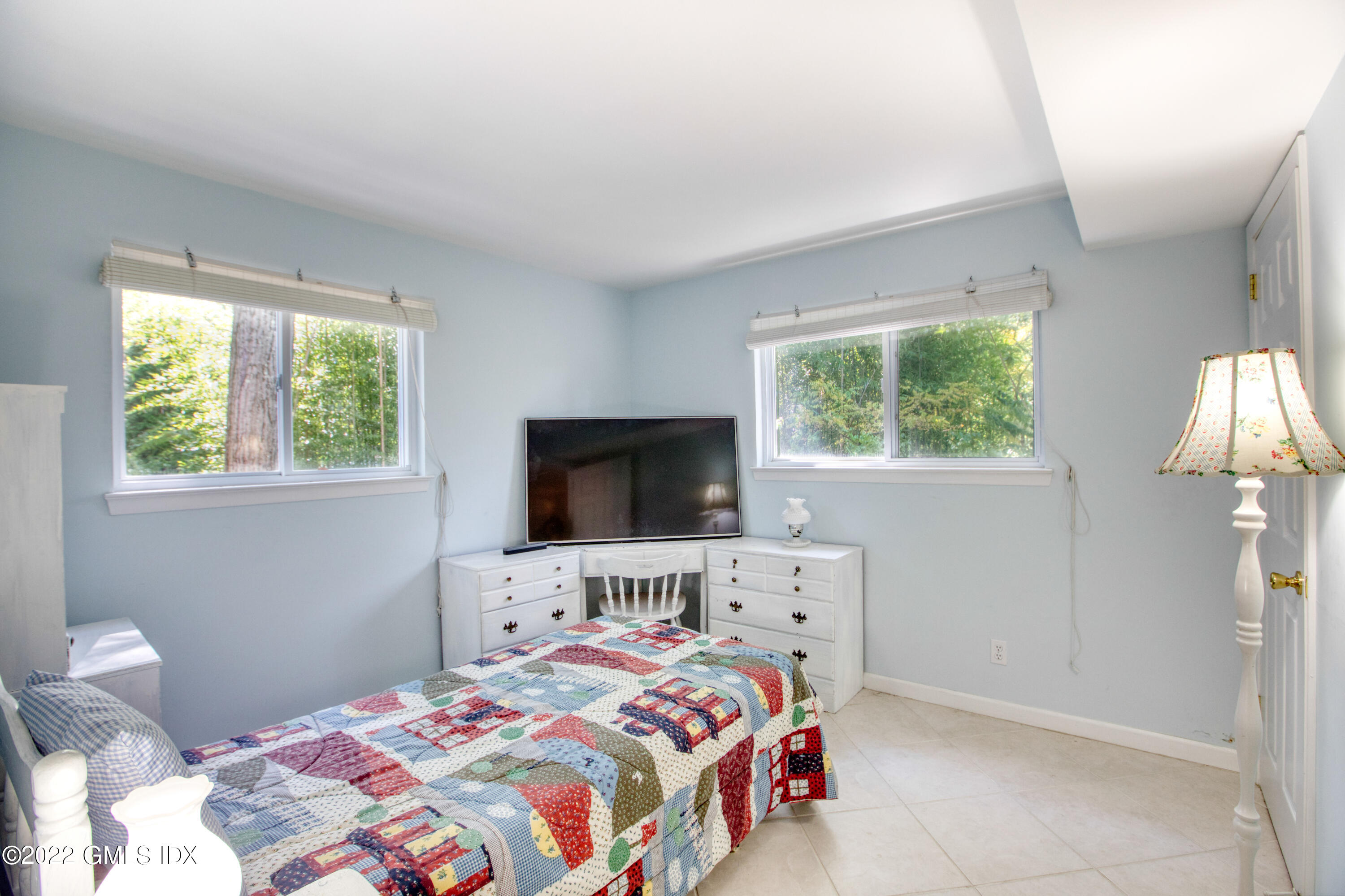 94 Florence Road Riverside, CT 06878 - Photo 16 of 25 a bedroom with a bed and a flat screen tv