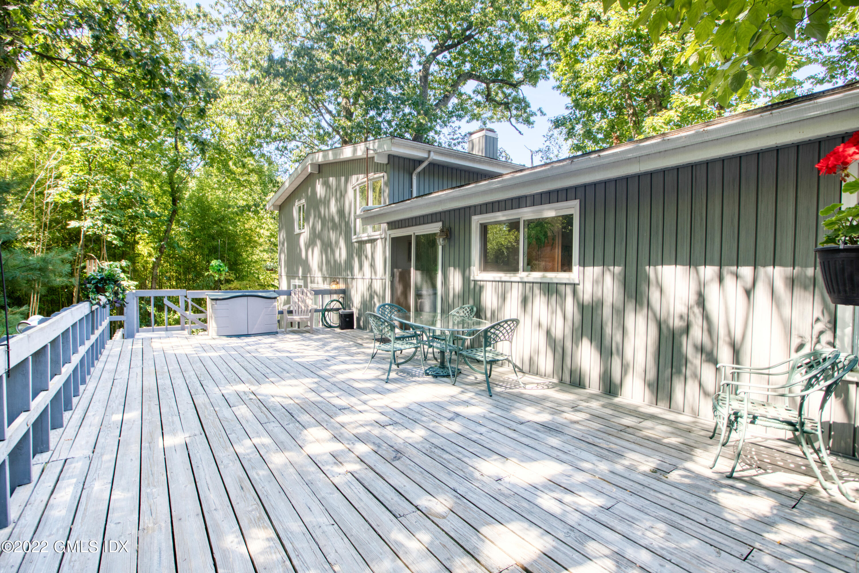 94 Florence Road Riverside, CT 06878 - Photo 18 of 25 a view of backyard with a deck and wooden floor