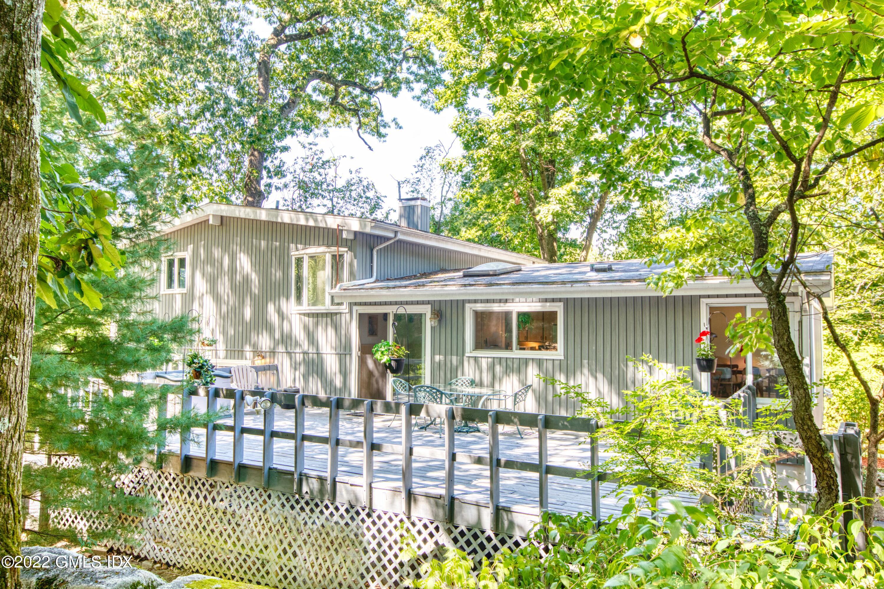 94 Florence Road Riverside, CT 06878 - Photo 2 of 25 a house view with a garden space