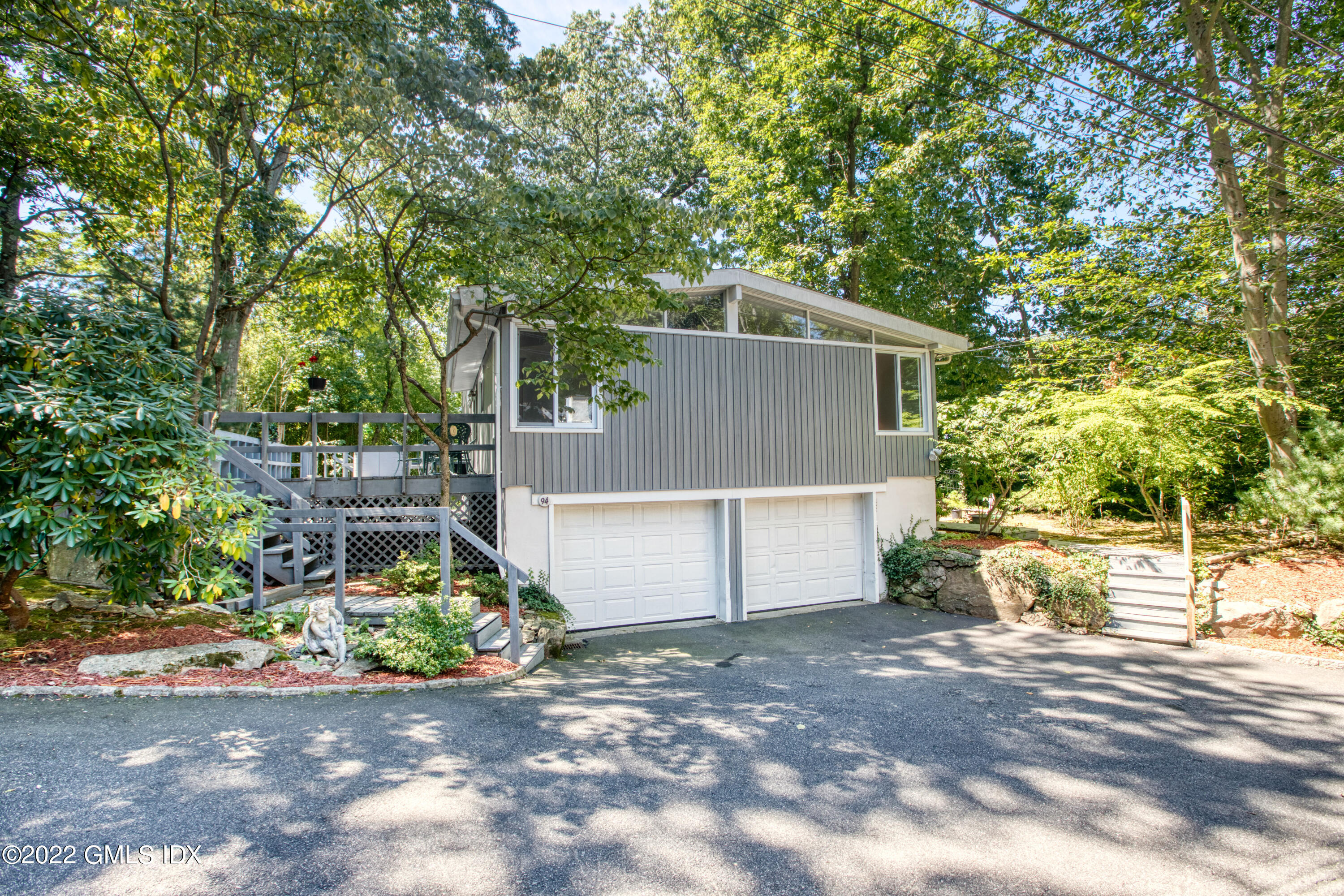 94 Florence Road Riverside, CT 06878 - Photo 21 of 25 a view of a house with a yard and street view