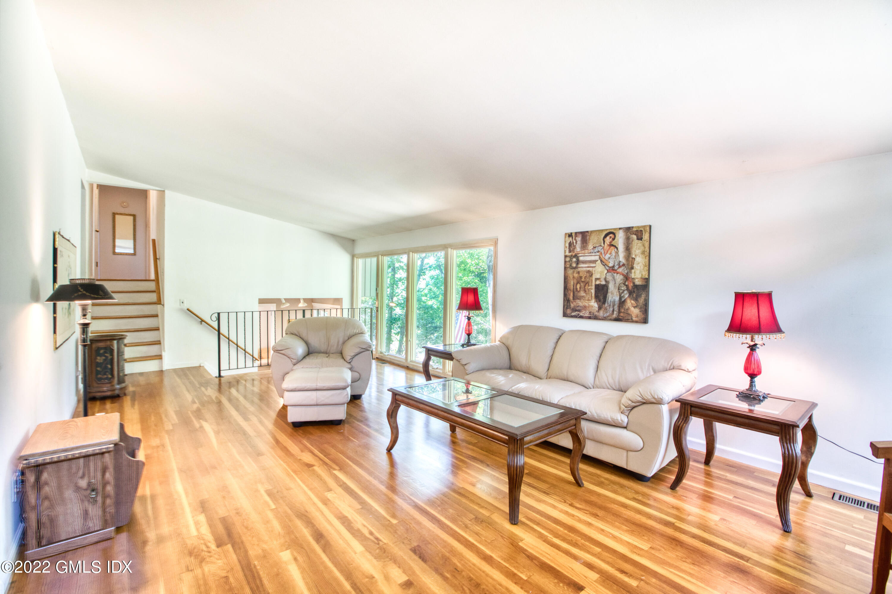 94 Florence Road Riverside, CT 06878 - Photo 4 of 25 a living room with furniture and a wooden floor
