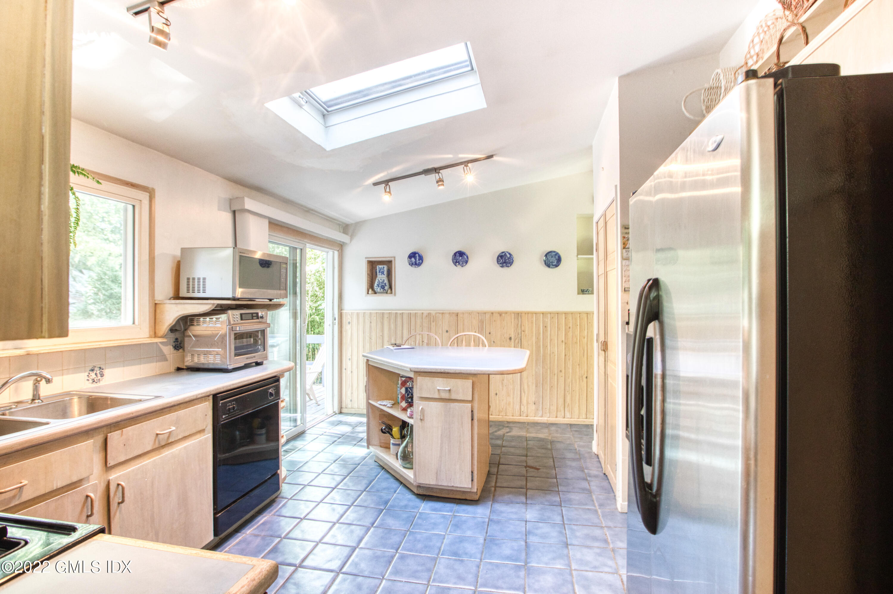 94 Florence Road Riverside, CT 06878 - Photo 7 of 25 a kitchen with stainless steel appliances granite countertop a refrigerator and a sink