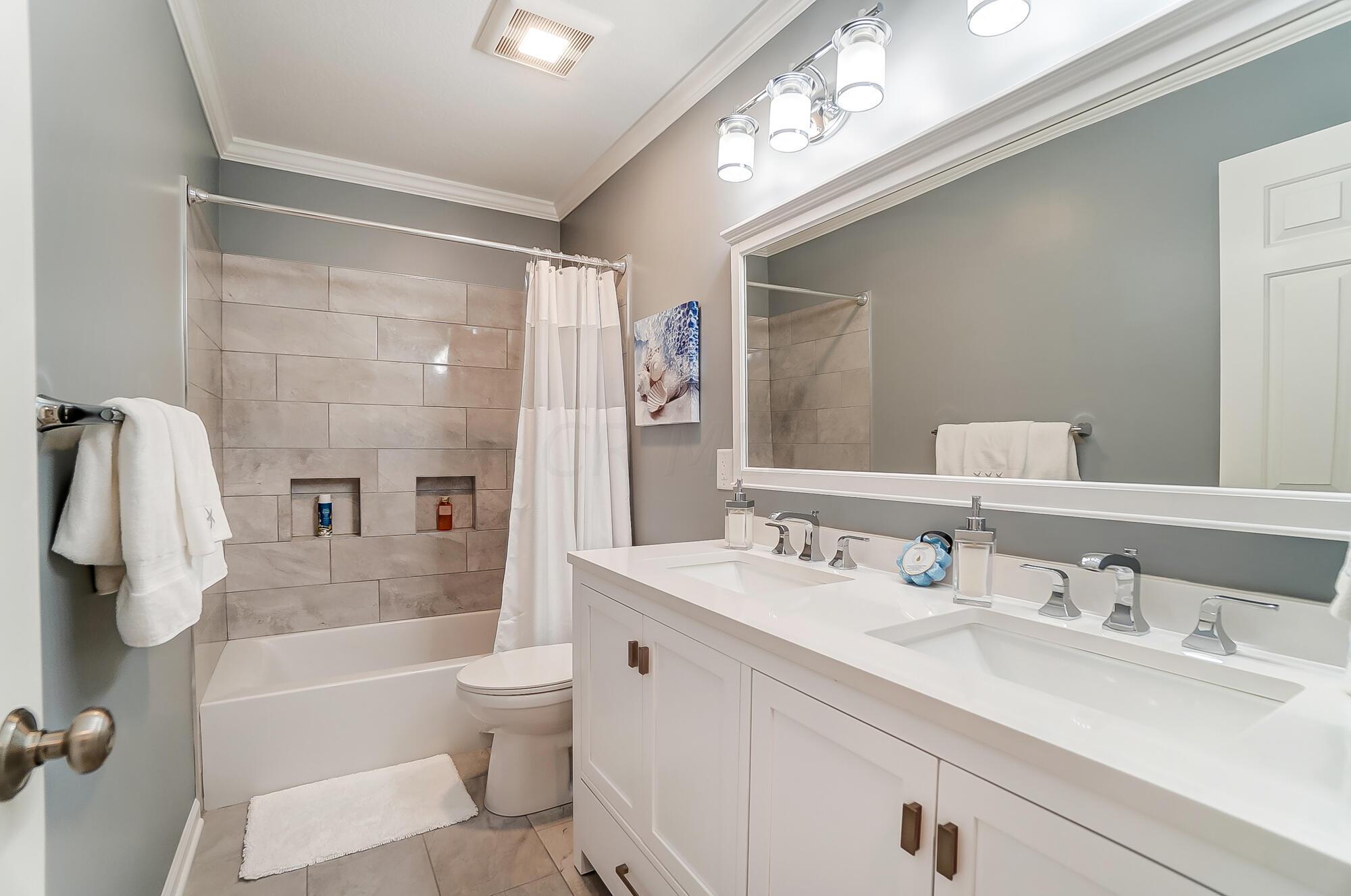 5674 Steward Road Galena, OH 43021 - Photo 64 of 82 Full bath on second floor family members has brand new vanity, double sinks, countertop, new toilet, tile & lighting.