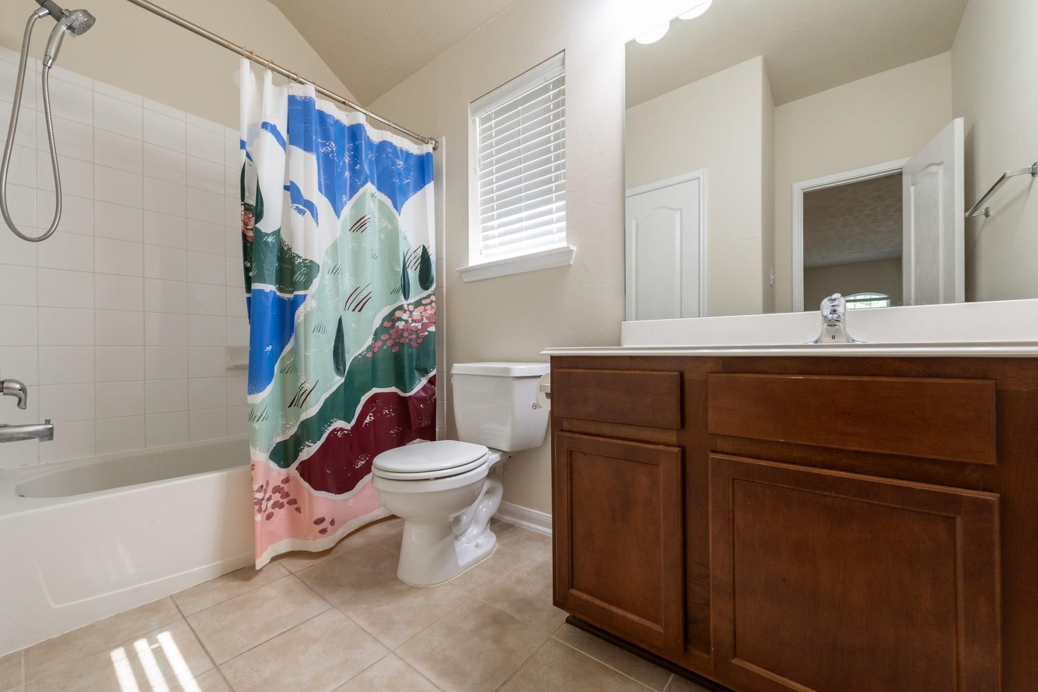 6402 Addlestone Ridge Lane Katy, TX 77494 - Photo 17 of 25 Well-appointed secondary bathroom features a tub/shower combination, generous vanity storage, and a window that provides abundant natural light. Conveniently located near the secondary bedrooms and game room.