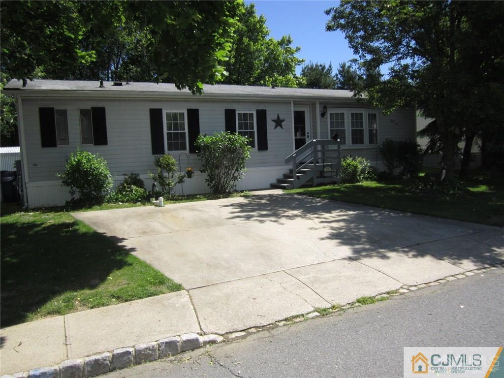 25 Longfellow Road, Unit 1 North Brunswick, NJ 08902 - Photo 1 of 17 a front view of house with yard
