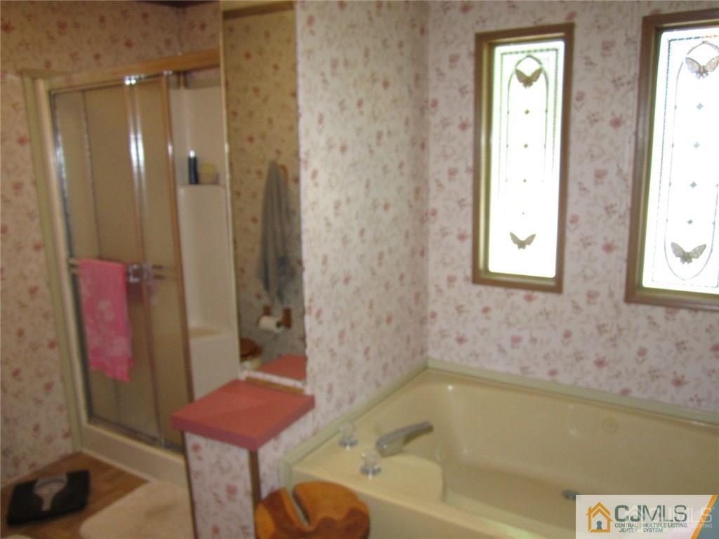 25 Longfellow Road, Unit 1 North Brunswick, NJ 08902 - Photo 14 of 17 a bathroom with a bathtub and shower