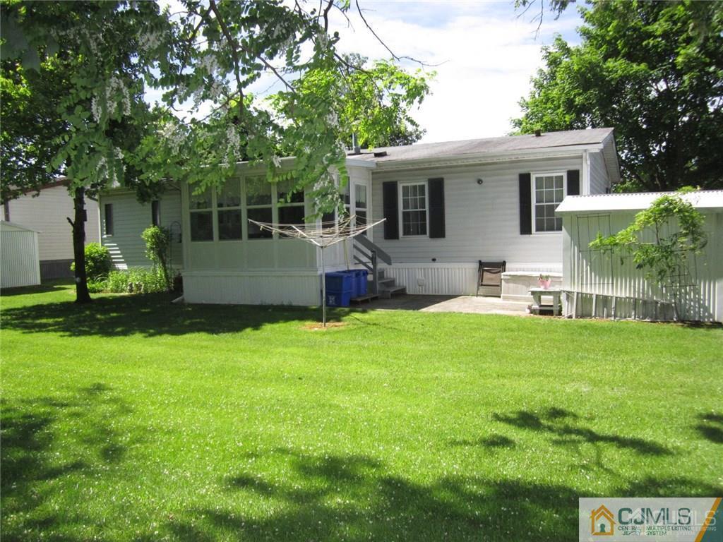 25 Longfellow Road, Unit 1 North Brunswick, NJ 08902 - Photo 16 of 17 a front view of house with yard and outdoor seating
