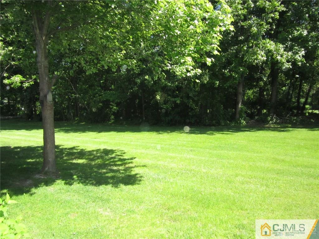 25 Longfellow Road, Unit 1 North Brunswick, NJ 08902 - Photo 17 of 17 a view of yard with swimming pool