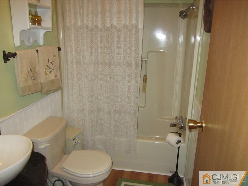 25 Longfellow Road, Unit 1 North Brunswick, NJ 08902 - Photo 10 of 17 a bathroom with a toilet and a shower