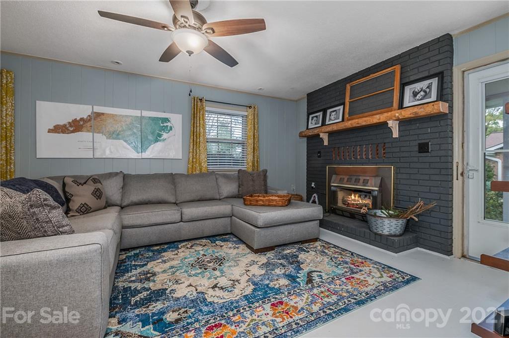 137 Anne Street Rutherfordton, NC 28139 - Photo 13 of 45 a living room with furniture and a fireplace