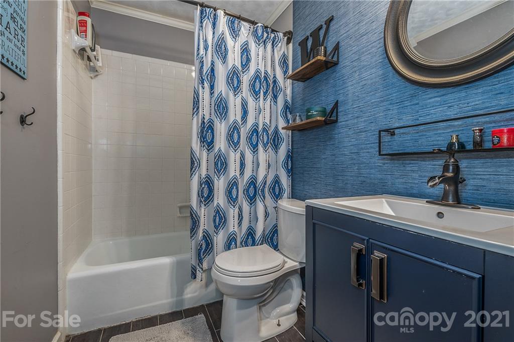 137 Anne Street Rutherfordton, NC 28139 - Photo 15 of 45 a bathroom with a sink toilet and shower