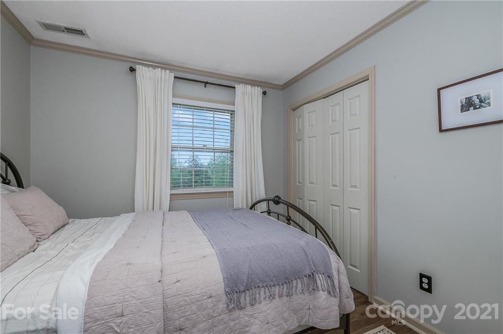 137 Anne Street Rutherfordton, NC 28139 - Photo 24 of 45 a bedroom with a bed and a window