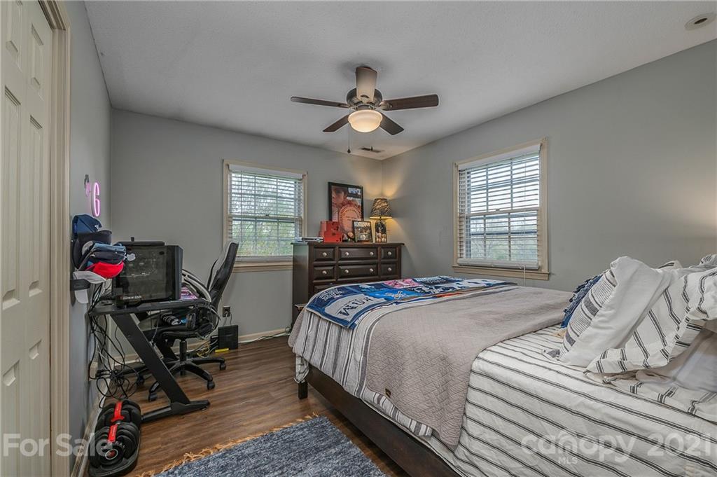 137 Anne Street Rutherfordton, NC 28139 - Photo 27 of 45 a bedroom with bed and a chandelier