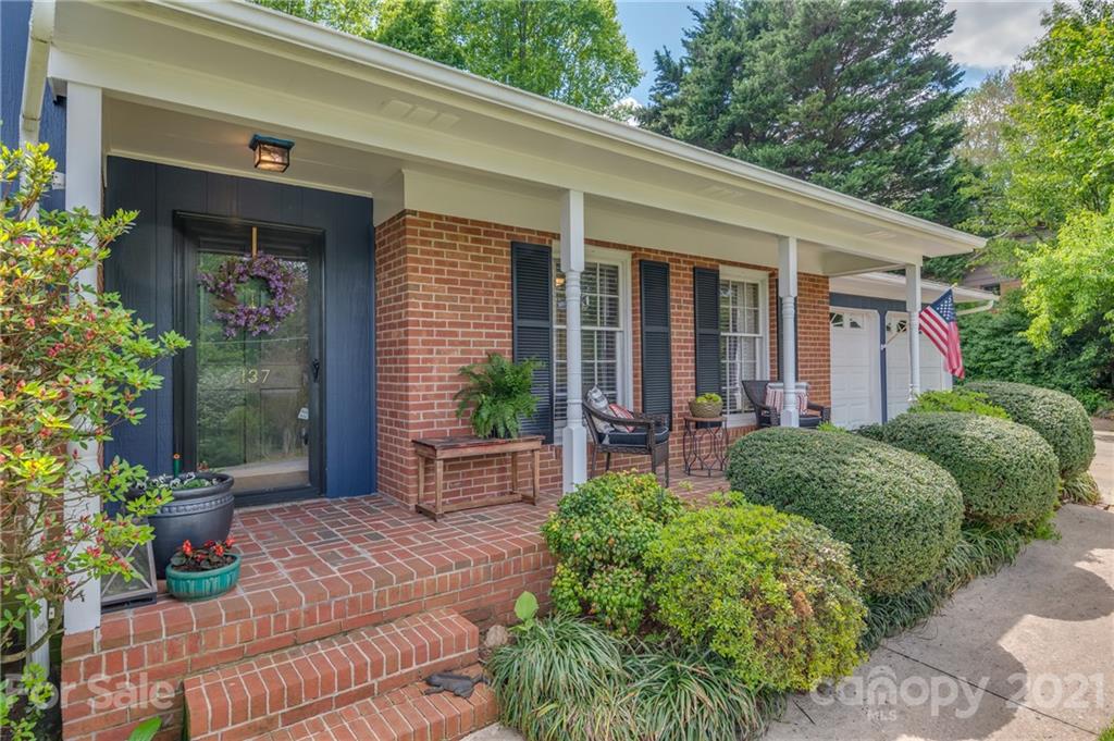 137 Anne Street Rutherfordton, NC 28139 - Photo 32 of 45 a front view of a house with garden