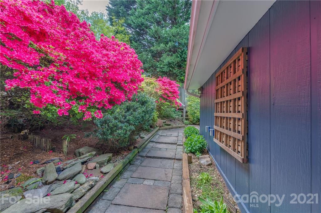 137 Anne Street Rutherfordton, NC 28139 - Photo 36 of 45 a view of a pathway with a flower garden