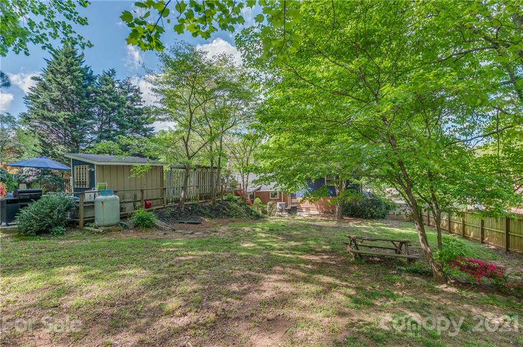 137 Anne Street Rutherfordton, NC 28139 - Photo 42 of 45 a backyard of a house with seating and trees