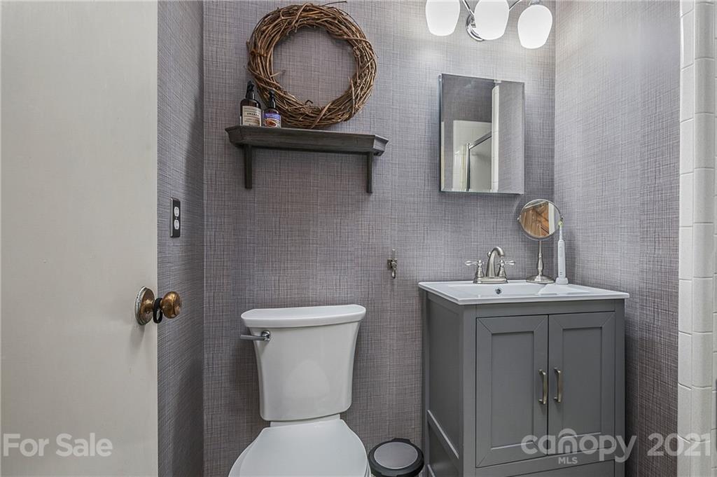 137 Anne Street Rutherfordton, NC 28139 - Photo 9 of 45 a bathroom with a toilet a sink and mirror