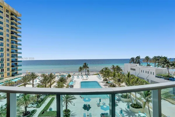 a view of a balcony with an ocean view
