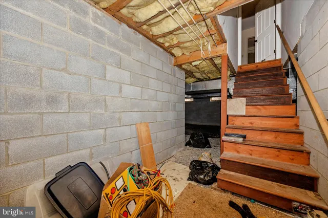 a front view of a house with a yard covered with snow in front of house