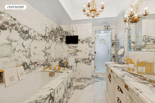 a bathroom with a sink mirror and a bath tub