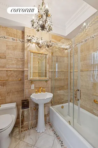 a bathroom with a sink mirror toilet and bathtub