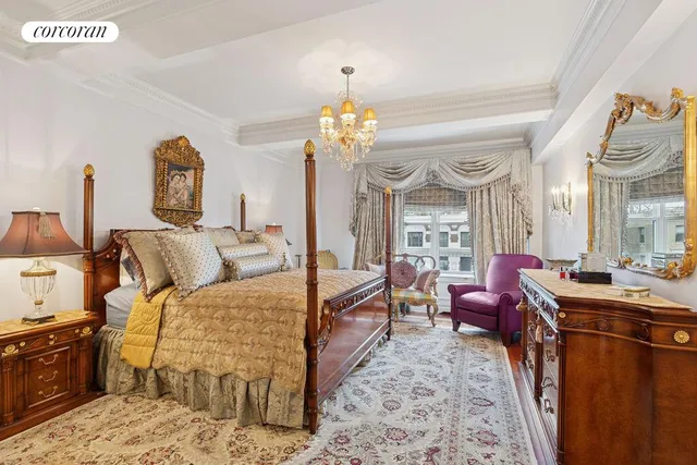 a bed room with a bed and a chandelier