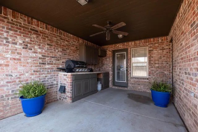 a kitchen with a potted plant