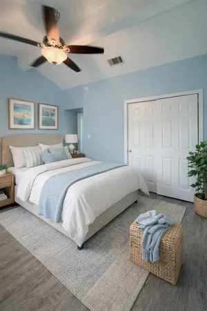 a spacious bedroom with a bed and a chandelier