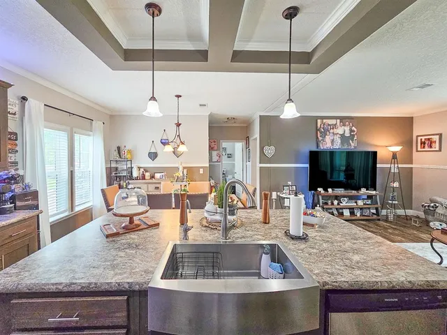 a living room with furniture and flat screen