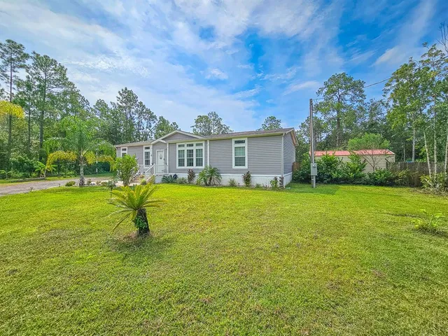 a house view with a garden space