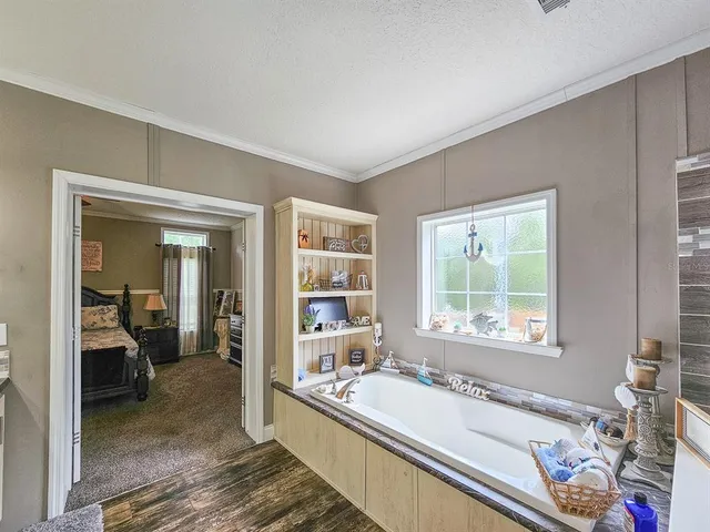 a bath tub sitting next to a window