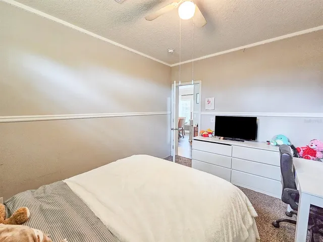a bathroom with a toilet sink and shower curtain