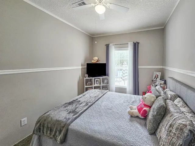 a view of a backyard with swimming pool