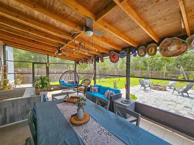 a view of a swimming pool with a lounge chair and garden