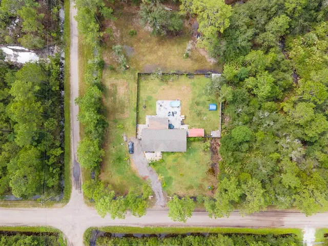 a view of a yard with an outdoor seating