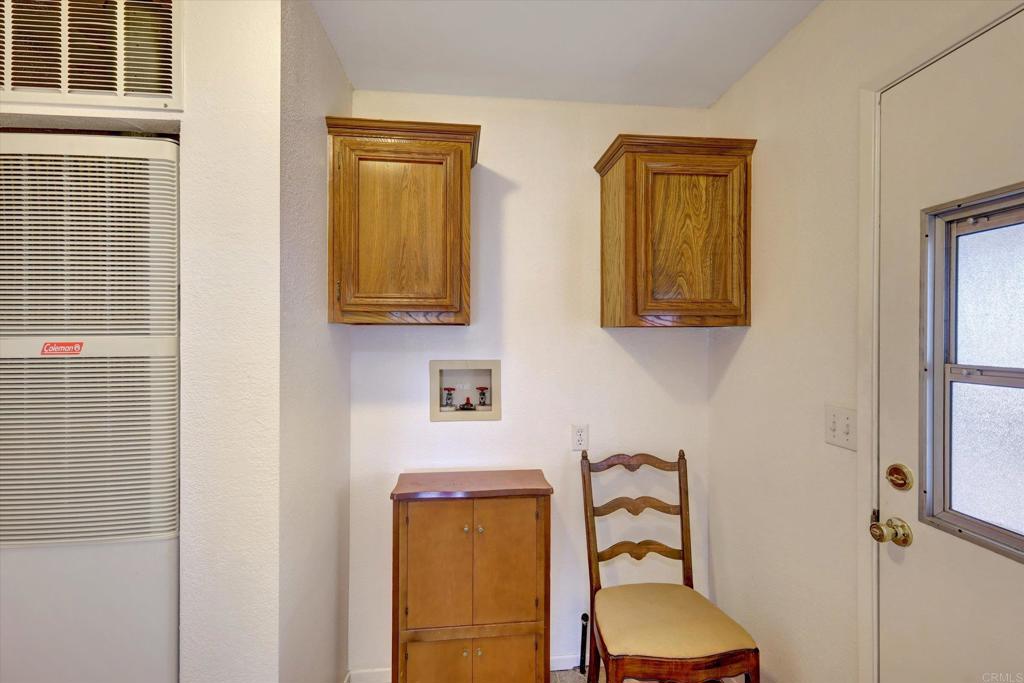205 Mockingbird Lane Oceanside, CA 92057 - Photo 13 of 28 a bathroom with a mirror and a shower