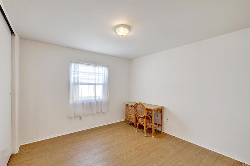 205 Mockingbird Lane Oceanside, CA 92057 - Photo 15 of 28 a view of a room with chair and window