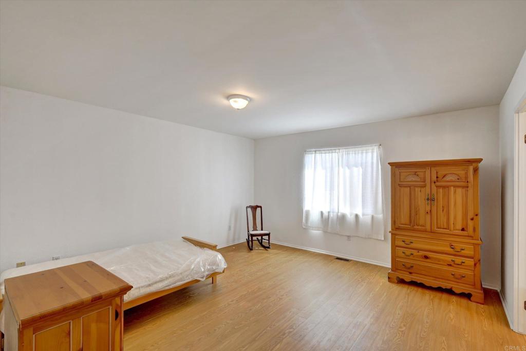 205 Mockingbird Lane Oceanside, CA 92057 - Photo 18 of 28 an empty room with windows