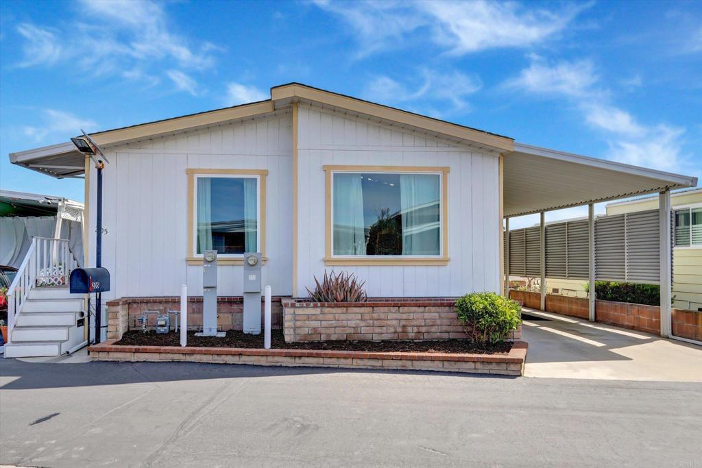 205 Mockingbird Lane Oceanside, CA 92057 - Photo 2 of 28 a front view of a house with porch
